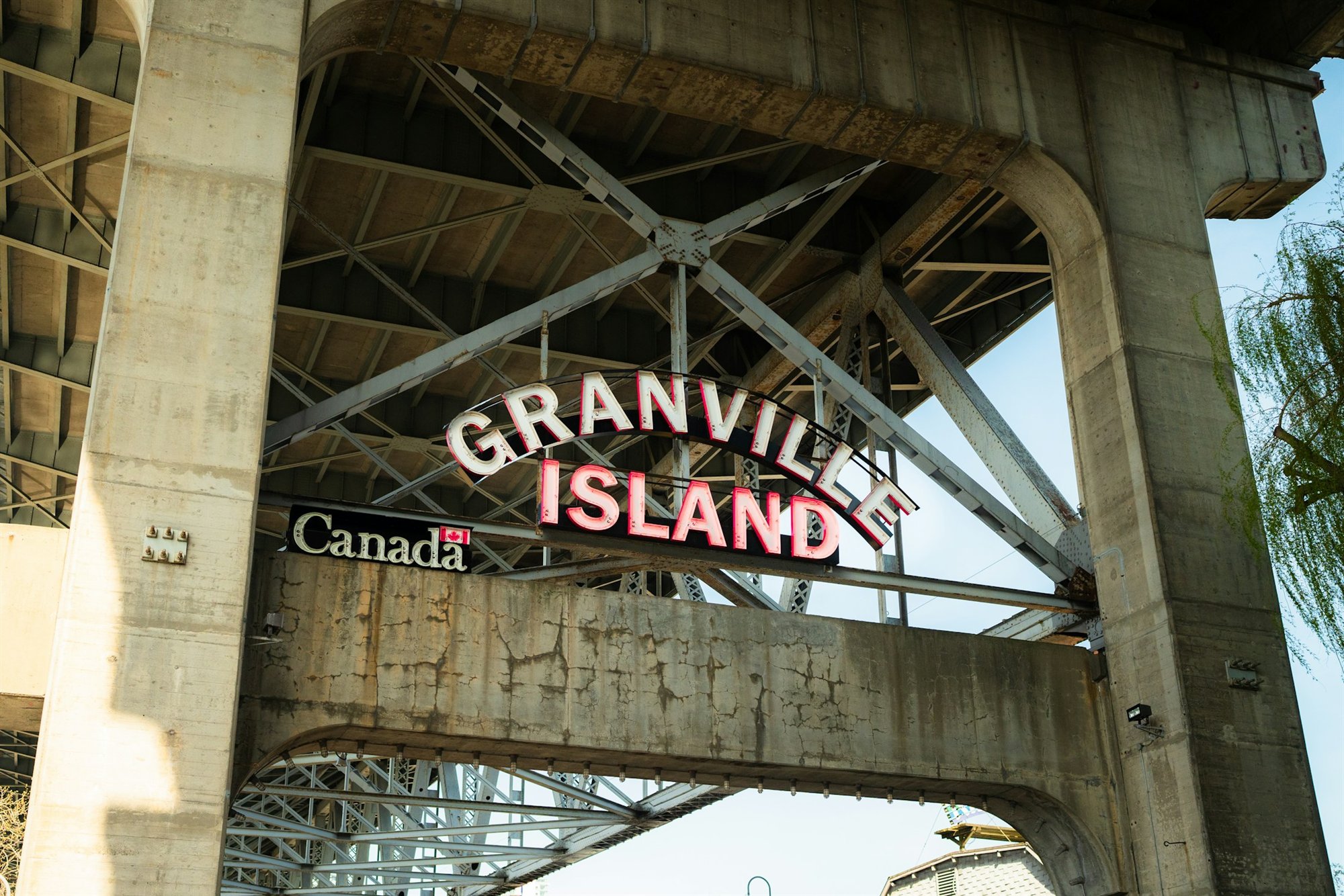 The illuminated Granville Island sign beneath the Granville Street Bridge